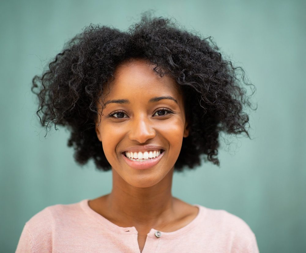 Smiling woman with curly hair