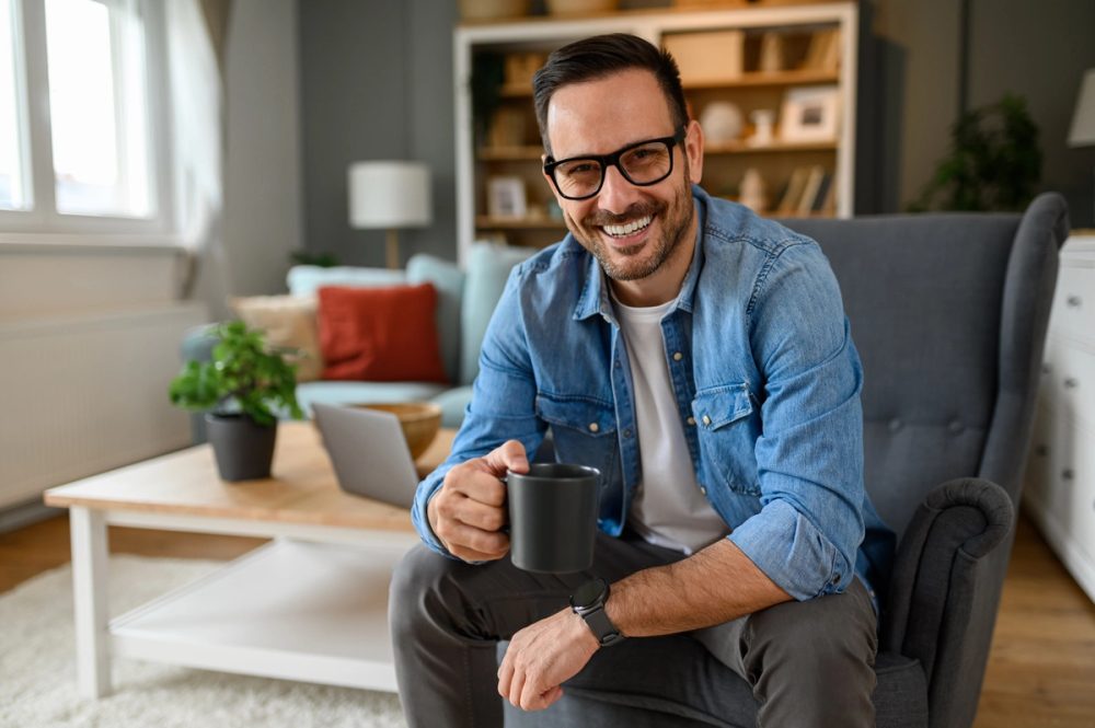 Relaxed man holding a cup of coffee